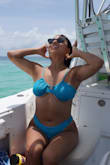 These bottoms have great coverage, and the netting details on the hips add a fun texture. It's hard to tell from my and the model photos, but the blue material has a glitter shine to it. I wore these on vacation in Puerto Rico for my best friend's bachelorette party and got lots of compliments on the swimsuit set. I swam and walked in them a lot, and they are very comfortable and never felt like they moved out of place. - Isabelle D.