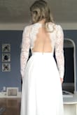Fit is great- material is good quality! Sleeves are crochet so no stretch but thankfully they fit me perfectly! Wearing this dress for both my bridal shower and rehearsal dinner. Had to hem it quite a lot at bottom because it was sooo long. So if you are tall / want to wear with high heels this won't be an issue for you! Very satisfied with purchase! - Mindy D.
