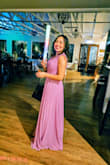 The material is chiffon-like and flows really nicely. It is a little long on me, but I didn't have it altered, I just wore a 3 in heels. It is a little tight around my chest, but it still zips fine. I did get a lot of compliments wearing it. - Christine S.