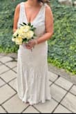 Had a low key wedding with 19 people, and the dress was perfect. I did get it hemmed due to my height. There was stretch to the dress as well. Some of the beading/sequin fell off, but can't beat the price! - Melanie S.