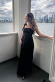 I bought this dress for a black-tie wedding, and it was absolutely perfect as a guest outfit. The quality is great, the fabric is lightweight, and it felt really comfortable all night. I tend to get bloated after eating and drinking, and this dress was ideal for keeping me confident since it drapes beautifully and hides the belly. The only downside is that it's very long when it arrives, and because it's pleated, hemming can be a bit pricier. Overall, I felt amazing wearing it and would highly recommend it. - Rosalie C.
