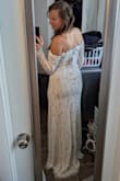 I knew I wanted a long sleeve lace wedding dress. 
This is the perfect lace detailing, and the comfortable lace! Not the itchy stiff lace! The dress has a grippy along the top of the bust to keep it in place, and I only wear nipple cups under it, and it holds in place well! 

It is not structured, so it does show your body form. Shapewear is an easy resolution! It's not a super long train, but just enough to show that there is a train. I love how it hugs my body and is super flattering. 

The layer underneath is beige, and it is an off white, not a true white. So keep that in mind. 

All in all, I am so excited to wear this for my wedding!!! - Gretchen H.