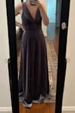 I purchased this dress for my sister's Fall wedding. I like the unique color, the weight, and comfortable fit. I ordered a small and may need it taken in at the shoulders, and definitely hemmed, but I don't think I could have gone down a size. It's pretty, but I wouldn't classify it as anything super special. Unfortunately dress arrived damaged; there is a tear in the plunging neckline. I don't have time to return and wait for an exchange, and I need to have it tailored anyway, but it was definitely disappointing. - Erin H.