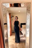 I bought this dress to wear as a guest to an October Texas wedding, and I'm so pleased with how it fits! With a medium heel on (no more than 3in), the length is just right and won't require any hemming (a small miracle for a short girl!). I love the low back and that it's contained enough to still be classy from all angles. My only comment is that I will probably use some fashion tape on the length of each side of my back to make sure the straps stay in place throughout the evening. I don't think it's absolutely necessary, but a precaution. - Paige B.