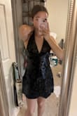For reference, I am 5'4 and the dress reaches right above the knee instead of the upper thigh like it appears on the model. The straps are also long, and it makes the v cut a lot lower than I was expecting. However, if I take in about 3 inches from the straps, the dress fits fine so I think the issue is in the straps, and that can easily be hemmed. - Monica M.