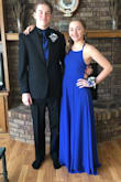 This dress is beautiful! The skirt is swishy if you walk right. There is a method to getting in and out of it but once you have it on you'll feel beautiful!! The fit was fantastic on me and it's such a high quality dress. The back is definitely adjustable and would fit a variety of sizes. I felt beautiful at prom!! - Emma V.