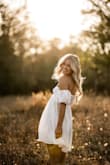 The dress fit like a glove and was perfect for my senior photo session. Feminine, flattering,  and flawless. - Jen W.