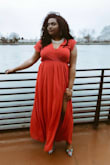 Bought this dress for a formal boat cruise, and it was perfect! The material takes it up a notch. Definitely formal and was warm enough for a windy D.C. cruise :) The sleeves are very dainty, which I loved. The slit was appropriate. I only used safety pins in the bust area--but just my preference! Would totally recommend this for a wedding or formal event! - Bria L.
