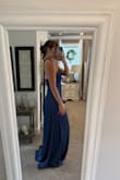 Such a beautiful gown! I wore it to a gala and it was perfect! I am between a small and a medium, so the top on this was sliiiiiightly loose on me, but the small was slightly too tight, especially for the satiny material. Was a tiny bit long on me (I am a little over 5'9), so keep in mind for those that are shorter- you may trip a little. Overall loved this dress and got SO MANY compliments! - Cassy S.