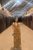 The dress is beautiful, and I've received several compliments. The fabric is nice, but the lining fabric is warm. It fits true to size at the bust, but it's very long. I had to cut one of the layers. Overall, I'm happy with the purchase, and I recommend this dress for your next formal event. - Erika S.