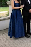 I bought this as a backup dress for a black tie wedding in case my rental didn't fit, and I'm so glad I brought this! It is a perfect length for tall girls, and the structure/overlay is so beautiful. The tie in the back allows for tightening as needed, and the straps are adjustable. I got a million compliments! - Emma K.