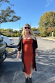 I loved the dress. The material was thick and very comfortable. I felt great in it all night. Received so many compliments on the color and fit. Wore a medium. - Toni-Anne S.