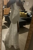 I didn't enjoy this process of putting on the dress; no stretch. It felt like sandpaper, made poorly, didn't like it had that long pink tag on it (but I understand.) It was not breathable and got warm fast. - Jodian C.