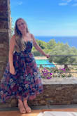 I bought this for a September wedding in the south of France. I love how flowy the skirt is and the beautiful colors. For me, this dress ran small. I am normally a size medium in Lulus dresses, but this dress was tight, so I had to exchange for a large, which fits perfectly. The undergarments have to be specific because of the gap between the chest area, but I was able to find something easily. The only negative was that the bust area was pretty itchy, so I would recommend full shape wear. - Tierney S.