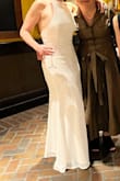 I LOVED THIS DRESS! It has Lulus satin fabric as the lining with a chiffon outer layer, so it has no stretch, but wow did I love it! I am a pear shape, so it was more loose on top and ever so slightly snug on the bottom, but honestly, it worked out beautifully. I received so many compliments all night! You could wear shape wear under it if you'd like to, but I chose not to since I don't like the feeling of shape wear. I just did nipple petals. I might even get this in another color or have this one dyed so I can wear it in the future for other events! - AJ J.