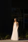 This dress was an absolute dream! I wasn't sure I'd love it just from the website photos, but I'm so glad I took a chance and ordered it. The second I tried it on, I knew it was the one. It made me feel so beautiful and ethereal. The dress is the perfect mix of romantic, a bit sexy, and fairy-like. I ordered a small and a medium and ended up going with the medium because it fit my bust better. It was comfortable to wear all day, and I didn't even have to alter it (a much-appreciated feature for short people like me). I couldn't imagine a better dress for my wedding day. - Dory B.
