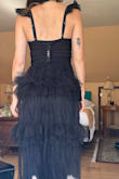 The material was amazing and it fit perfectly. Needed a steam before the event, but that's to be expected. - Scarlet V.