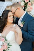 I was 9 months postpartum, breastfeeding, was recovering from severe diastasis recti and was not planning on getting married until I'd had more time to get in better shape. Then my dad got diagnosed with stage 4 cancer and we decided to throw together a wedding with only 6 weeks to plan so that my father could attend. I called the best bridal shops locally, but they were all booked out for months, as it was peak-wedding season. Plus, I felt silly spending a bunch of money on a dress when we were already a little family of 3 paying a mortgage. So I got this $100 dress in Size Large. I added a Pearl & rhinestone belt (also purchased from lulus) and sewed that to the dress. And I was very happy with it. It's a simple and timeless dress with an elegant and forgiving silhouette. I did have to get it hemmed quite a bit as I wore flats, but that's to be expected. Very happy with this dress!!! - Elizabeth T.