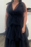If you decide to go with this dress, be ready for compliments all night! The fit is beautiful and surprisingly comfortable. The neckline is definitely low-cut, so if you're fuller on top, I recommend finding a bra option that feels both secure and flattering. When I first tried it on, I used the "cakes" push-up pads, but they peeked out a bit, so I ended up ordering some push-up sticky bra pads from Amazon instead. They worked better, though I still added a small pin for extra coverage. Overall, this dress is gorgeous and made me feel confident and beautiful the entire evening. Perfect for a wedding guest look that's equal parts elegant and fun. - Cristina R.