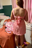 I ordered size small for my daughter. She's 5'4, about 140lbs, 34B. I measured her waist and hips at 29" and 40". She has an athletic body and a booty. The small fit her perfectly. We didn't have to make any adjustments. The tie-back allows for flexibility in the upper body, which helped make this fit nicely. She didn't have to worry about wearing a bra. The dress looks just like the photos. Has beautiful detail, thick material, well made. It was easy to steam out the wrinkles. The second picture (back view) is straight out of the bag. - Cory P.