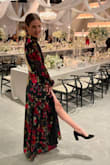 I absolutely loved wearing this dress at the black tie wedding we attended. The dress fit like a glove and was so comfortable. I could eat, dance, and sit comfortably all night. I felt sexy and confident. The long sleeves and high neck were a gorgeous contrast to the high slit and backless aspects. I hope there's another event in my future so I can wear it again!!!! - Alex M.