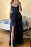 Loved this dress. It was a little big on me, but I ordered the wrong size, and the turn around time was too tight, so it still worked! Got lots of compliments throughout the night and was definitely long enough for someone tall! - Emma R.