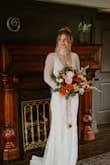 I can't begin to say how beautiful I felt in this dress. It's relatively lightweight, fits like a glove, and the quality was amazing. I did not need any alterations. The train is short, but you may want to add a bustle depending on your height. - Hannah R.