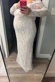 This dress was better than I expected, but the quality of the sewing was awful. It didn't fit right because it was [sewn] in a place it shouldn't have been [sewn]. So it bunched up and wouldn't lay flat. The lace appliqué around the neckline was cheap looking, and I kinda wish the dress didn't have it. I do like the dress but just disappointed in those things. Also, I'm 25 weeks pregnant, 5'8 and 220 lbs. The dress did fit and was slightly loose in the bust area. - Emily M.
