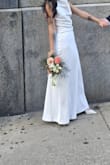 I absolutely love this dress. I wore it for my civil wedding, and it was stunning. I am petite so the length was too much for me, but even tho it was still really beautiful. Fits your body perfectly. I got an XS btw - Maria S.
