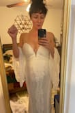 This is my dress I will get married in! The detailing is absolutely stunning, there is grip in the bra area to hold it up, with a small pad for the girls. It is very long but nothing a hem can't fix! The champagne under tone really makes it pop! I do think this is a true white color. BUY THIS DRESS!!!! It's elegant and sexy! The sweetheart neckline is perfect and the mesh between the cleavage is actually very nice. Quality is great, feels amazing. Cannot beat the price! I am completely obsessed with this dress. I added sleeves from amazing for a complete look for under 200$ - Renee N.