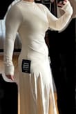 I absolutely love this dress! It's a stretchy thick material and has a double line on the top to the waist (you can see it in the product pictures). I wore nude tights underneath (lighting in the pic is not doing me ANY favors here, it wasn't quite as unflattering without spanx in person) and was so comfortable all night. I am 5'5, 171lbs, 36D, 30" waist, and 41" hip. - Kaitlyn O.