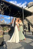 I wore this dress for my wedding and I absolutely loved it. I ordered a size S because the XS was sold out; it was a little big, but it felt comfortable in my arms. I had to have the dress shortened by about 10cm because it was too long for me. However, I felt sensational wearing my dress and seeing how everyone appreciated it. I truly felt radiant that day. And it arrived in two days. - Isabel L.