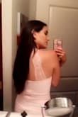 I just love this dress. The beautiful blush pink and lace detail on the back make me feel so feminine when I'm wearing it! The material is thick and stretchy. Great dress - Gisela G.