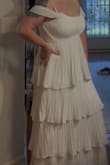 I was going to return the dress because the top part was very loose and didn't look right. However, I bought a different bra and made it work. I also bought a cardigan since my bridal shower is in the winter. - Autumn H.