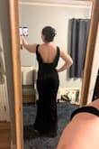 This dress is super comfortable. Originally ordered a large and returned it to size down to a medium. It looks beautiful and is super flattering. It's a bit long, and I am taking it to get altered. There was a slight rip in the shoulder, and the zipper is stuck, so that's why I couldn't give it 5 stars. - Teresa F.