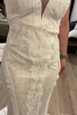 This dress was beautiful, the lace was delicate and pretty and I liked the color. Unfortunately is just ran really large based on their size chart. The lace hem is scalloped so it would be difficult to hem and keep the shape. I almost kept it and was going to pull up the material from the waist but decided against it. - Jaime L.