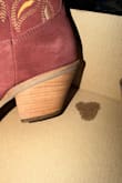 the bottom and inside heels are obviously worn, and there's wear on the inside pull tabs. The box has grease stains, and so do the shoes. This is obviously someone's return they tried to pass off to another unsuspecting customer. Infuriating for such expensive boots. Not even worth it on sale. So disappointed cause my size isn't in stock anymore. - Dee L.