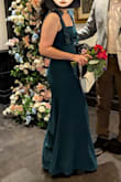 It was really long for me, so I had it shortened. It was beautiful as it is (length), I just preferred it shorter. I got a lot of compliments from my family, and I really felt beautiful in it. The bow strap was my favorite thing, but the slit was also perfect. I loved it. - M R.