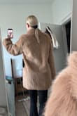 I'm usually between a small and a medium and bought both. I will be keeping the small (the pics are in the size S) as it runs oversized. Definitely a keeper! - Alyssa G.