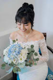 I was a little nervous about ordering my wedding dress online, but I'm so glad I took the chance. The dress is absolutely gorgeous, even more beautiful in person than in the photos. The detailing is delicate and elegant, the fit is surprisingly perfect, and the fabric feels high-quality and comfortable to wear. I felt like a true bride the moment I put it on. I've received so many compliments, and it made my special day feel even more magical. - Thao N.