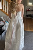 Oh my god I am so obsessed with this dress!!!! It literally fit perfectly, the corset back is so cute and the floral fabric is STUNNING. I think it would be a great reception dress or bridal shower dress, but I was looking at it for my wedding dress and the fabric didn't go well with my veil (which has floral lace). I'm so sad because I really do love this dress so much it is so flattering and just gorgeous. - Abby K.