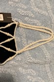 This is 1st product I've ordered from Lulus that I would say is poor quality. The pearls are very yellow. The straps are flimsy, and it almost seems like a little girl's toy. It looks and feels very cheap. It shouldn't be more than $10, and even then I wouldn't keep it. - Dina S.