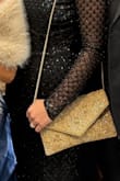 This clutch complete my outfit so beautifully. All my accents were gold so it fit right in. It's also very durable, it was not flimsy or cheap-like. - Bre A.