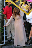 I wore it for my daughter's christening, I ordered a large knowing I was not back to pre pregnancy size but big mistake, the dress is made for a more free flowing fit just as it looks but it was too loose.  It was too long for my height but heels helped. I had to have the entire thing altered: the length, split, waist, sleeves, the chest(only because I wore it to church so it was a little revealing for the occasion, but otherwise the cut is flattering)so I should've just ordered a medium!!! The material was light, perfect for the style of the dress, and handled the alterations well.  I loved it once it fit correctly. I felt amazing in my dress, I got many compliments. I would definitely recommend. I felt like a Queen on my Princess's special day!
My shoes are also from Lulus - Myra A.