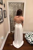 I bought this for my engagement photos, and I am very pleased! The back is to die for. I noticed that the front was a little looser than my liking, so I am going to get it altered to pull up the front just a tad to make it tighter. but that is completely a preference!  I ordered a small. - Jenna T.