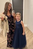 This dress is absolutely stunning on and off the hanger. I received compliments all night at the wedding we attended. It fit me like I had it made just for me. I will say if I were even a few pounds heavier, I would probably have gone up one size. I ordered a small. And if I had time, I would have had it hemmed about a half inch. I was stepping on it in the back a lot that evening, but it hung right to the floor in the shoes I was in so I got away with it. The color and fit are gorgeous. I especially loved the top. I was worried that being strapless would make it difficult to dance in, but it stayed up all night. I even brought another dress to change into just in case, but I barely had to ever pull it up. It has a rubbery strip along the top edge that helps it hang on. And the keep V was pretty without being too much. I can't say enough good things about this dress. I can't wait to wear it again! - Joy D.