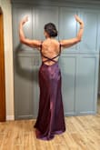 This dress is amazing! The plum color and the fit were stunning. The small train made me feel elegant. I felt like royalty for the evening and received many compliments on my gown. Forgive the vanity shots from the back.. my daughter insisted. Don't delay if you are thinking about it. Buy this gown. - Emma Z.