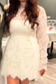 This dress was absolutely stunning! I wore it after my wedding ceremony for a more relaxed look while still staying elegant, and everyone complimented it! The material is excellent, and the delicate details on the sleeves, along with the tutu under the skirt, added such a special touch! - Verenisse V.