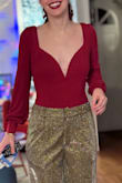 The color is beautiful. A true holiday red. Fabric is soft and comfy.
Love the structure of the plunging neckline. It's very flattering! The back is open to about the middle back, so lovely. It does fit more like a thong bodysuit, at least it did for m,e since I have a curvier hip area. Love it so much, highly recommend! - Caitlin F.