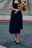 This is my favorite dress. Fits great, feels good (the corset is amazing), the material is shiny which enhances its black color and looks super elegant in black heels. I love it! - Lyn G.